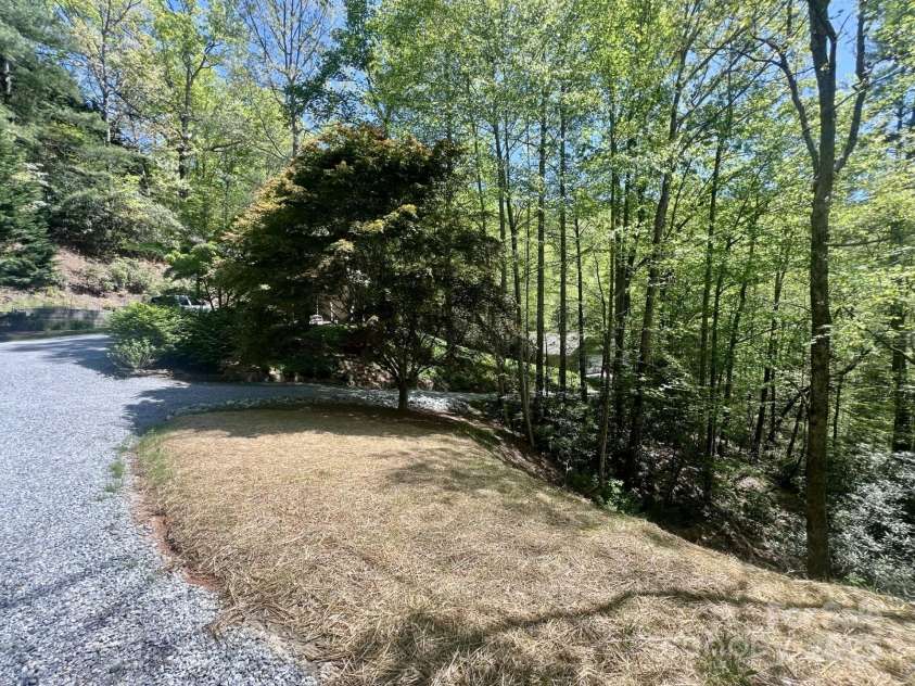544 Jeter Mountain Road, Penrose, NC 28766.  MLS# CAR4251034, YatesRealty ID 13890. House With Detached Garage Below