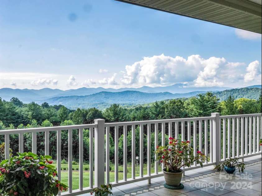 72 Bentwood Drive, Candler, NC 28715.  MLS# CAR4173355, YatesRealty ID 13897. View from main house porch