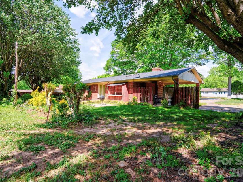 1202 Ridgemont Avenue, Shelby, NC 28150.  MLS# CAR4368310, YatesRealty ID 13898. Rear & Left Side