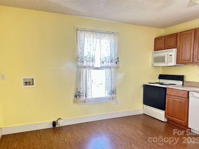 1277 Virginia Road, Marion, NC 28752.  MLS# CAR4244101, YatesRealty ID 13898. Laundry location but other areas in the home to move it.  There is a side porch or bonus room adjoining the bedroom and bathroom