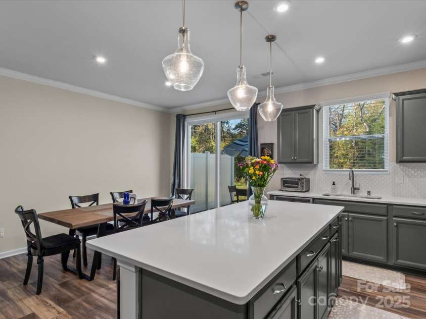 18014 Pear Hawthorne Drive, Huntersville, NC 28078.  MLS# CAR4198859, YatesRealty ID 13899. Large dining area and room for bar stools at the island making entertaining a breeze.