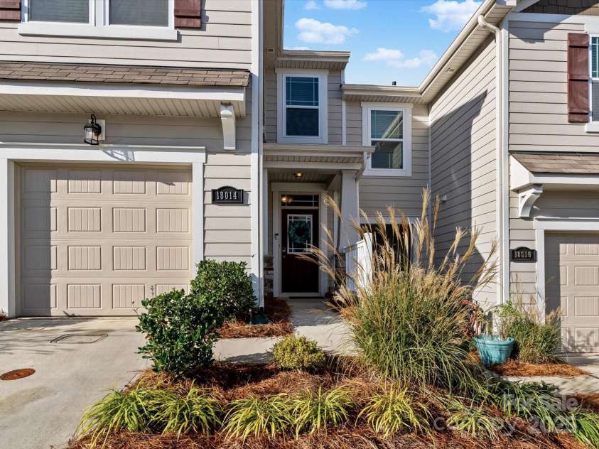 18014 Pear Hawthorne Drive, Huntersville, NC 28078.  MLS# CAR4198859, YatesRealty ID 13899. Welcome to 18014 Pear Hawthorne with a covered front porch and an extra- deep garage for extra storage.