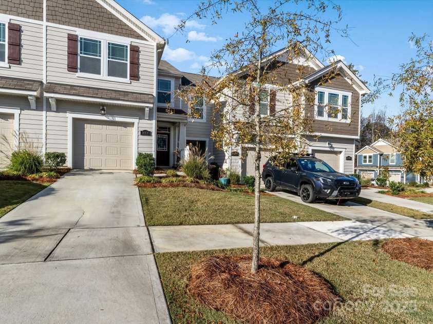 18014 Pear Hawthorne Drive, Huntersville, NC 28078.  MLS# CAR4198859, YatesRealty ID 13899. With a level, private back yard and patio, oversized garage, this 