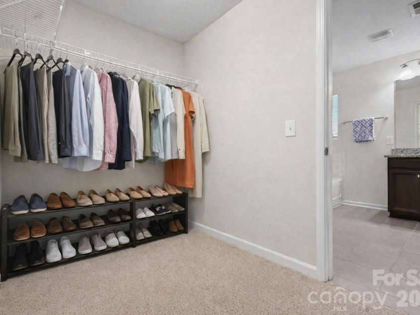 109 Creekside Crossing Lane, Mooresville, NC 28117.  MLS# CAR4343305, YatesRealty ID 13902. Primary Suite Closet Virtually Staged