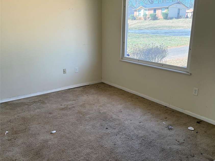 1406 Milan Road, Charlotte, NC 28216.  MLS# CAR4206975, YatesRealty ID 1391. Living room