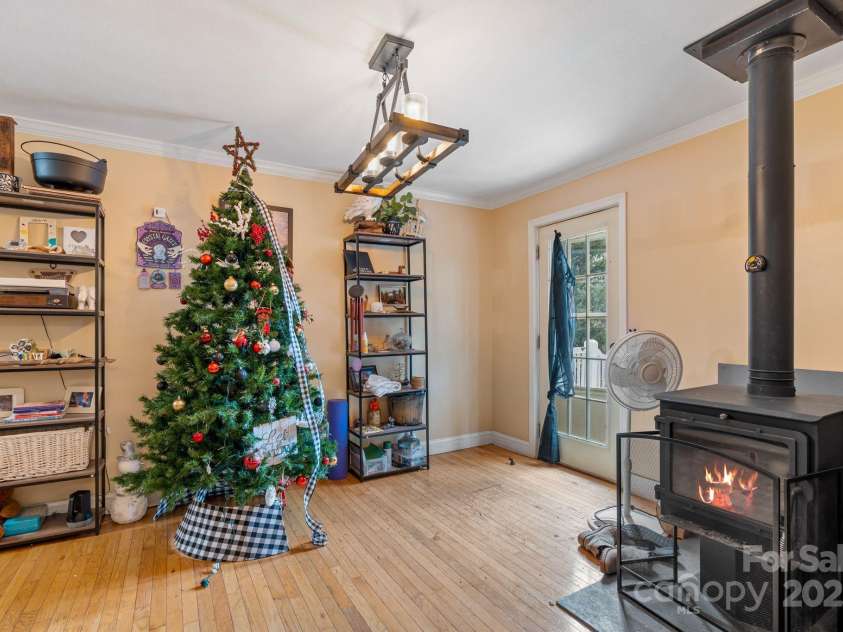 308 Browntown Road, Leicester, NC 28748.  MLS# CAR4216858, YatesRealty ID 13916. Dining Room with wood stove