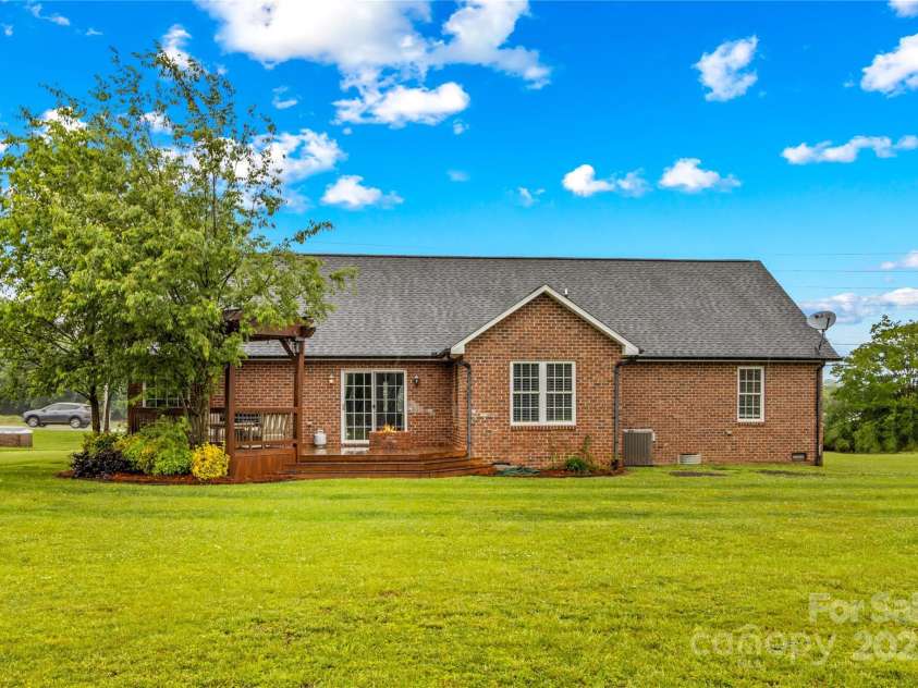 4336 Hunter Rhyne Road, Lincolnton, NC 28092.  MLS# CAR4257970, YatesRealty ID 13917. 4336 Hunter Rhyne Rd Lincolnton NC 28092 rear view of deck, pergola, fire pit