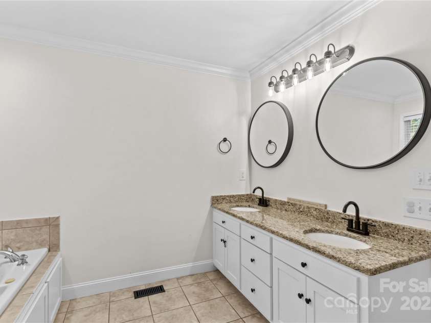 4336 Hunter Rhyne Road, Lincolnton, NC 28092.  MLS# CAR4257970, YatesRealty ID 13917. Dual sinks, granite counter top and tile flooring