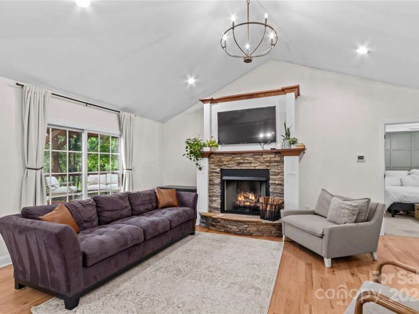 4336 Hunter Rhyne Road, Lincolnton, NC 28092.  MLS# CAR4257970, YatesRealty ID 13917. Family Room with gas log fireplace, stone accent and tv mount.   Patio doors to rear deck.