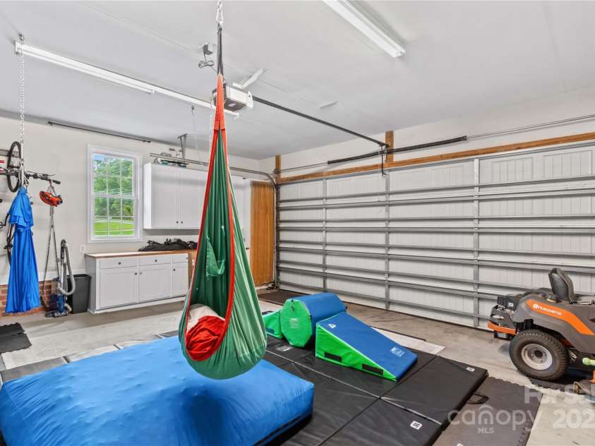 4336 Hunter Rhyne Road, Lincolnton, NC 28092.  MLS# CAR4257970, YatesRealty ID 13917. Garage with built in cabinets, set up for jungle gym (equipment does not convey)