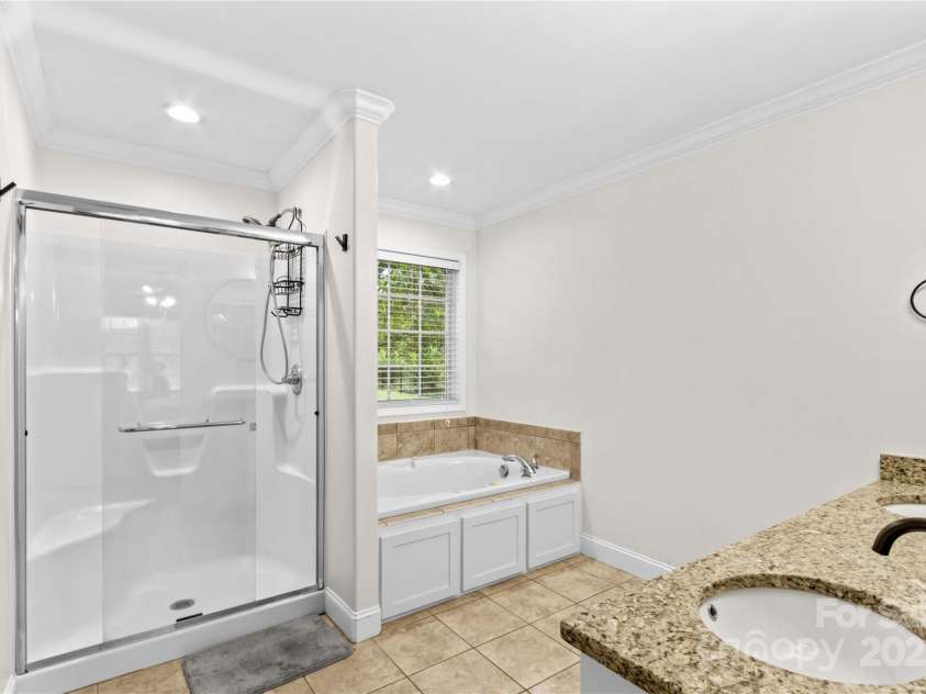 4336 Hunter Rhyne Road, Lincolnton, NC 28092.  MLS# CAR4257970, YatesRealty ID 13917. Primary Bath with jetted tub, walk in shower and dual sinks