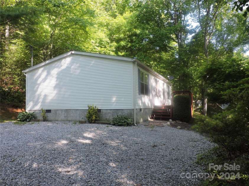 2271 Gouges Creek Road, Spruce Pine, NC 28777.  MLS# CAR4202059, YatesRealty ID 13919. Side of house