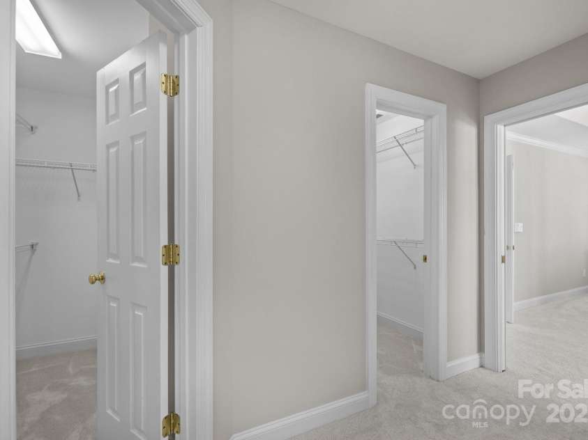 7543 Bluestar Lane, Charlotte, NC 28226.  MLS# CAR4220288, YatesRealty ID 1392. Dressing area with Two large walk-in closets