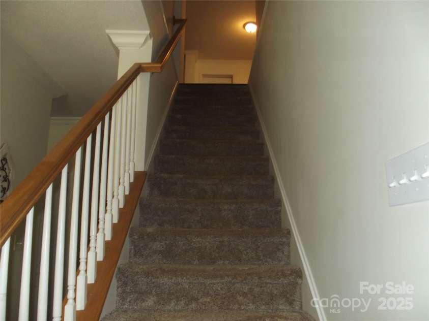 1502 Mulberry Ridge Drive, Newton, NC 28658.  MLS# CAR4252057, YatesRealty ID 13929. Stairs with Carpet