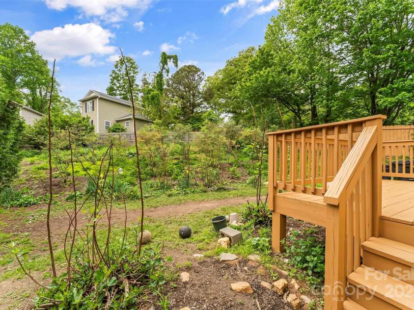 29 Byrd Road, Black Mountain, NC 28711.  MLS# CAR4254878, YatesRealty ID 13949. Lovingly maintained tiered backyard with gardens