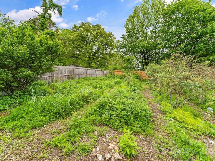 29 Byrd Road, Black Mountain, NC 28711.  MLS# CAR4254878, YatesRealty ID 13949. Lovingly maintained tiered backyard with plentiful gardens
