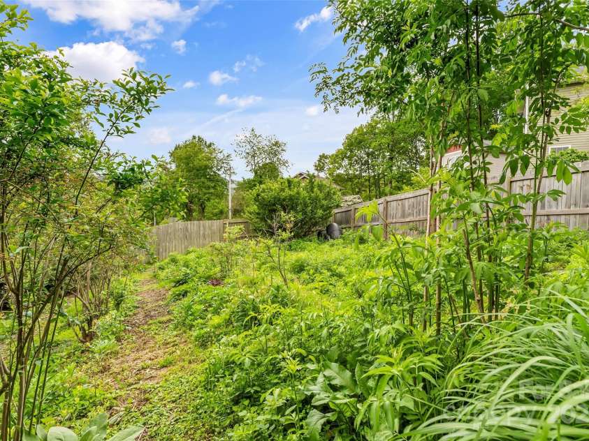 29 Byrd Road, Black Mountain, NC 28711.  MLS# CAR4254878, YatesRealty ID 13949. Lush tiered backyard gardens