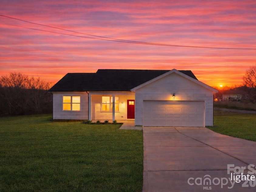 103 Willies Lane, Olin, NC 28660.  MLS# CAR4332219, YatesRealty ID 13950. Virtually staged sunset photo.