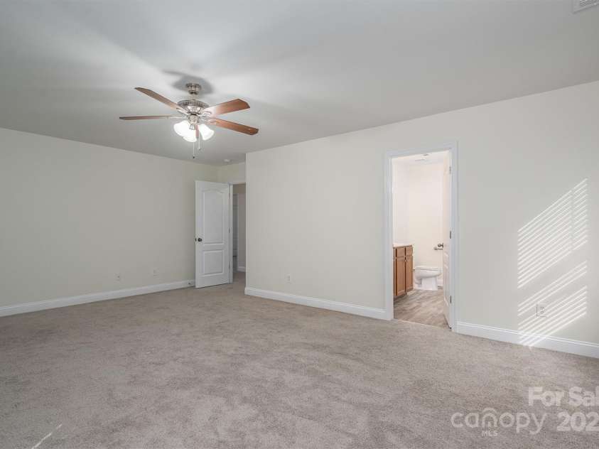 125 Colville Road, Mooresville, NC 28117.  MLS# CAR4240810, YatesRealty ID 13954. Primary Bedroom