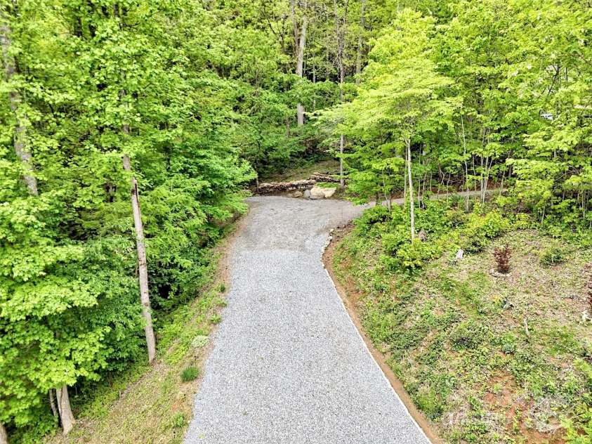 265 Gobbler Ridge, Sylva, NC 28779.  MLS# CAR4256383, YatesRealty ID 13958. Driveway to the house.