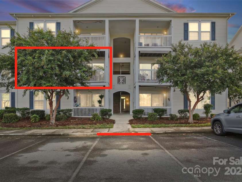 3845 Carl Parmer Drive, Harrisburg, NC 28075.  MLS# CAR4300180, YatesRealty ID 1396. Unit and parking space noted with the red box and line.