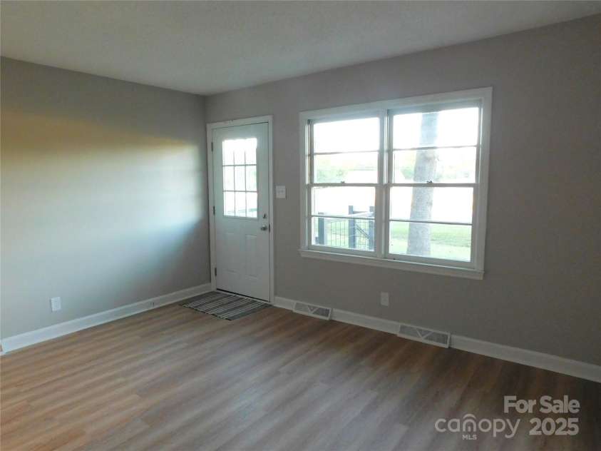 8600 Highway 74 Highway, Marshville, NC 28103.  MLS# CAR4312582, YatesRealty ID 1396. Living room view 2