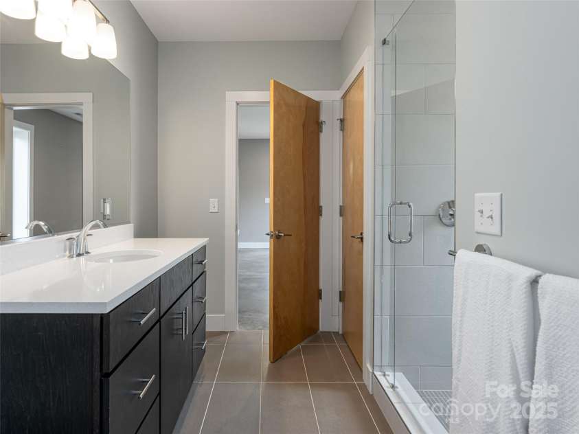 7 Mauricet Lane, Asheville, NC 28806.  MLS# CAR4241872, YatesRealty ID 13963. Awesome Lower level bath is a second primary bath.