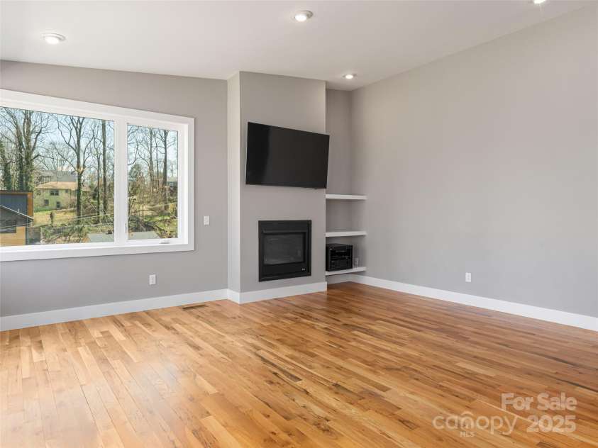 7 Mauricet Lane, Asheville, NC 28806.  MLS# CAR4241872, YatesRealty ID 13963. Gas Fireplace and media nook