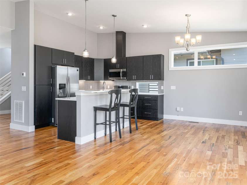 7 Mauricet Lane, Asheville, NC 28806.  MLS# CAR4241872, YatesRealty ID 13963. Island with breakfast bar.
