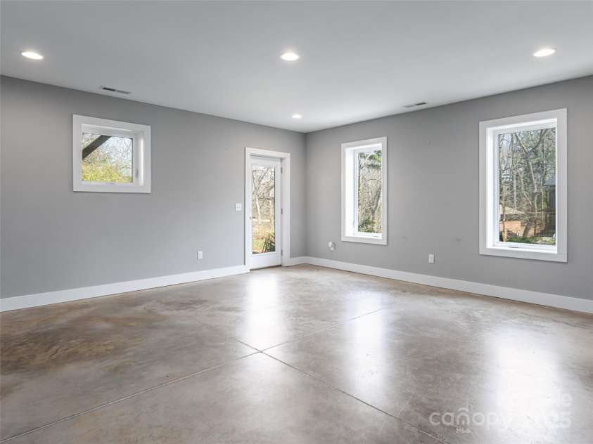 7 Mauricet Lane, Asheville, NC 28806.  MLS# CAR4241872, YatesRealty ID 13963. Windows bring in awesome light to the basement level