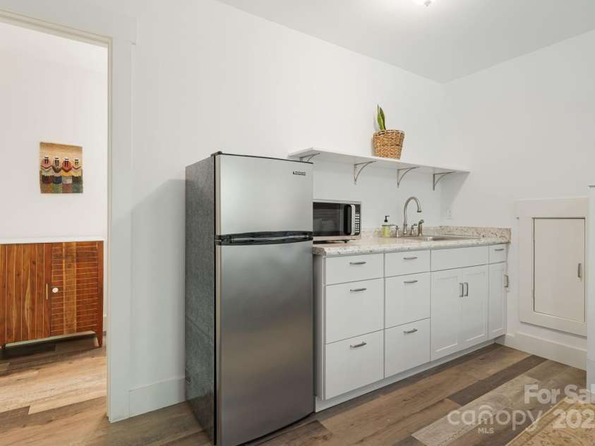 14 3rd Street, Asheville, NC 28803.  MLS# CAR4297140, YatesRealty ID 1397. This additional sqft would be a great in law / guest suite or rental space. 