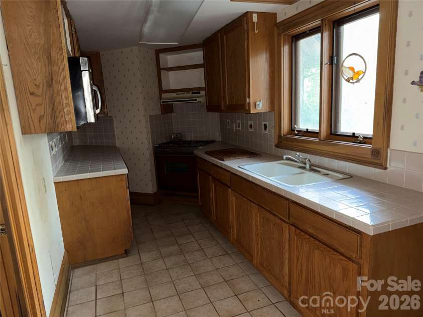 388 Island Creek Road, Lake Lure, NC 28746.  MLS# CAR4358771, YatesRealty ID 13970. 