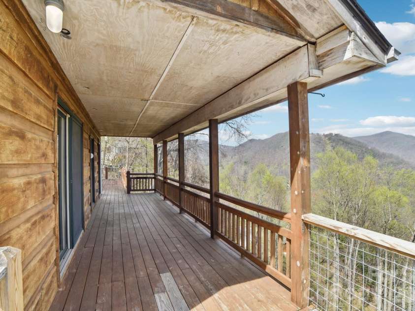1426 Setzer Cove Road, Maggie Valley, NC 28751.  MLS# CAR4249259, YatesRealty ID 13972. Part of the upper deck is covered