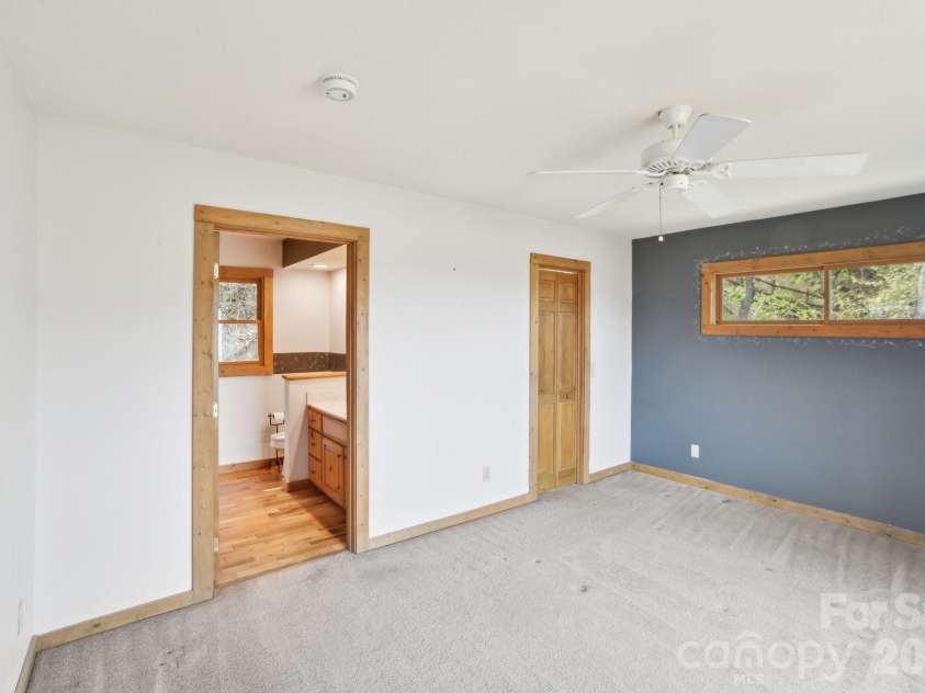 1426 Setzer Cove Road, Maggie Valley, NC 28751.  MLS# CAR4249259, YatesRealty ID 13972. Primary suite off of the large living space