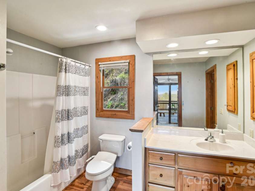 1426 Setzer Cove Road, Maggie Valley, NC 28751.  MLS# CAR4249259, YatesRealty ID 13972. Second bathroom with access directly from the 2nd bedroom or living space