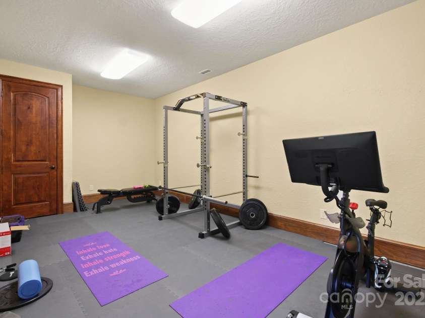 693 Thunderhill Trail, Blowing Rock, NC 28605.  MLS# CAR4253716, YatesRealty ID 13972. Exercise room off theater