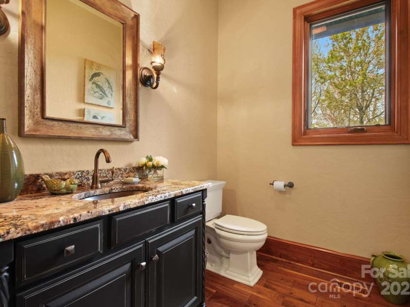 693 Thunderhill Trail, Blowing Rock, NC 28605.  MLS# CAR4253716, YatesRealty ID 13972. Main-level half bath near breezeway