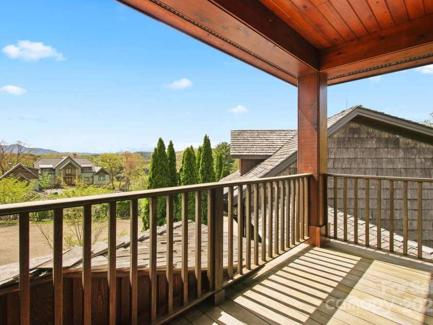 693 Thunderhill Trail, Blowing Rock, NC 28605.  MLS# CAR4253716, YatesRealty ID 13972. Upper-level suite 1 with full bath & private deck - profile view of Grandfather Mountain!