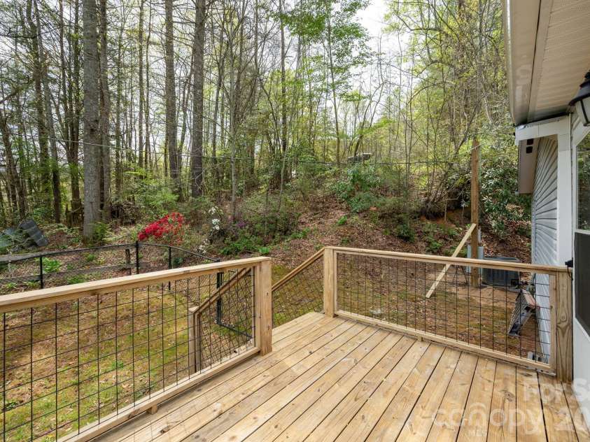 37 Camden Way, Rosman, NC 28772.  MLS# CAR4366138, YatesRealty ID 13983. Back deck