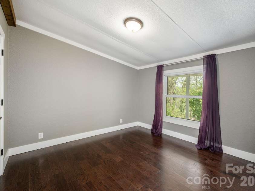 37 Camden Way, Rosman, NC 28772.  MLS# CAR4366138, YatesRealty ID 13983. Primary Bedroom