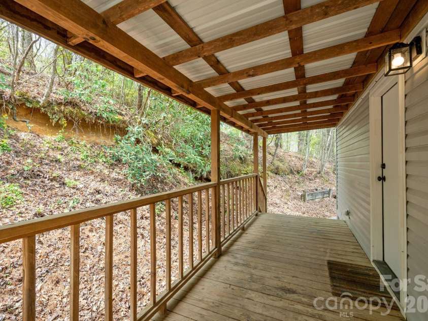 37 Camden Way, Rosman, NC 28772.  MLS# CAR4366138, YatesRealty ID 13983. Side Deck