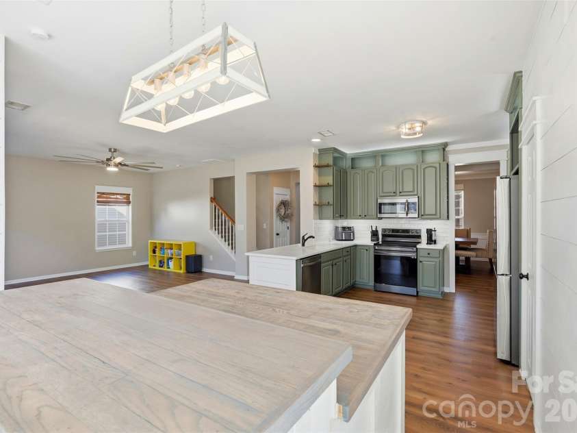 6004 Brook Valley Run, Monroe, NC 28110.  MLS# CAR4344182, YatesRealty ID 13984. Breakfast area- custom lighting/great natural lighting!
