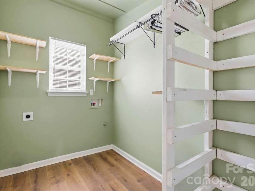 6004 Brook Valley Run, Monroe, NC 28110.  MLS# CAR4344182, YatesRealty ID 13984. Laundry room on main w/ custom shelving!