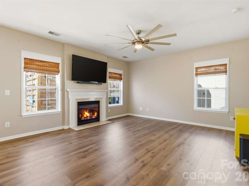 6004 Brook Valley Run, Monroe, NC 28110.  MLS# CAR4344182, YatesRealty ID 13984. Living room w/ gas fireplace