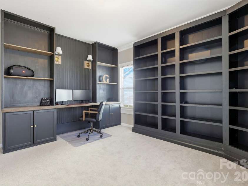 6004 Brook Valley Run, Monroe, NC 28110.  MLS# CAR4344182, YatesRealty ID 13984. Main level office w/ custom built Library Millwork desk!
