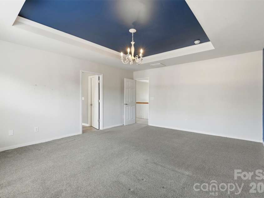 6004 Brook Valley Run, Monroe, NC 28110.  MLS# CAR4344182, YatesRealty ID 13984. Primary bedroom- tray ceiling, ensuite bath, spacious WIC