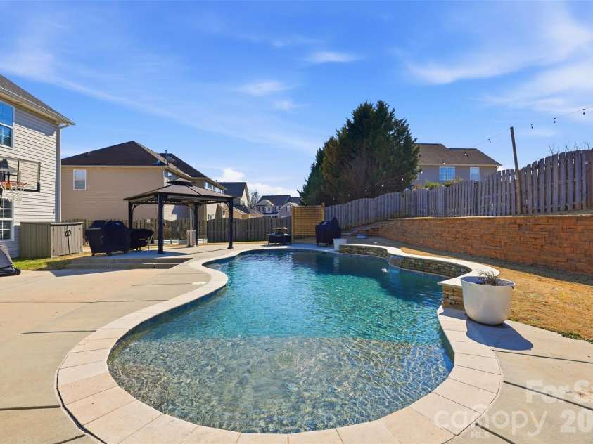 6004 Brook Valley Run, Monroe, NC 28110.  MLS# CAR4344182, YatesRealty ID 13984. Sylvan Gunite pool w/ Pebbletec finish!