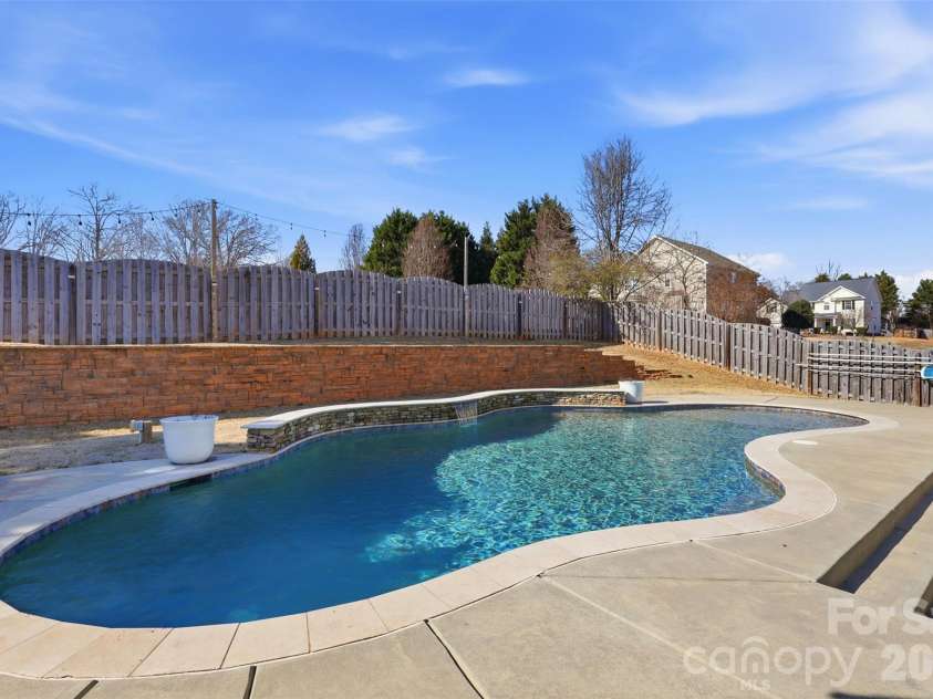 6004 Brook Valley Run, Monroe, NC 28110.  MLS# CAR4344182, YatesRealty ID 13984. Sylvan Gunite pool w/ Pebbletec finish!
