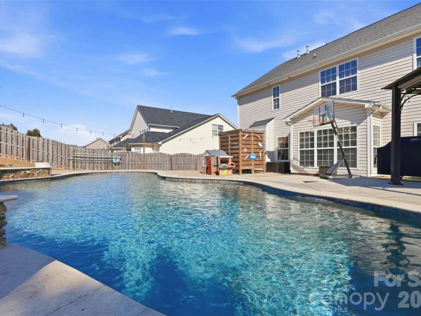 6004 Brook Valley Run, Monroe, NC 28110.  MLS# CAR4344182, YatesRealty ID 13984. Sylvan Gunite pool w/ Pebbletec finish!