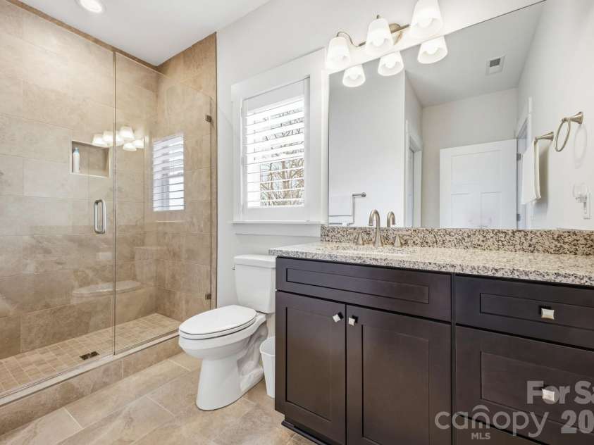 2 Lifestyle Court, Arden, NC 28704.  MLS# CAR4360396, YatesRealty ID 13985. Dual sinks with granite countertop